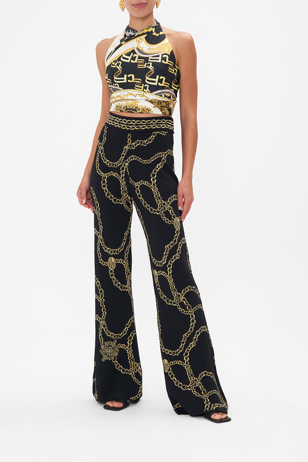 Front view model wearing of CAMILLA flared knit pants in Jealousy And Jewels print