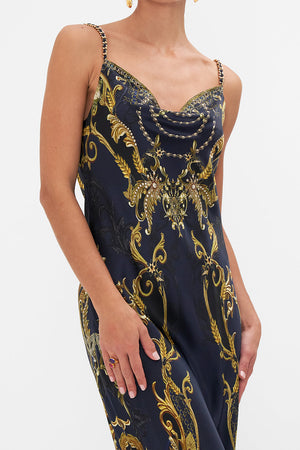Detail view of model wearing CAMILLA bias silk slip dress in Moonlight Melodies print
