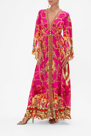 Side view of model wearing CAMILLA pink silk maxi dress in Wild And Running  print 