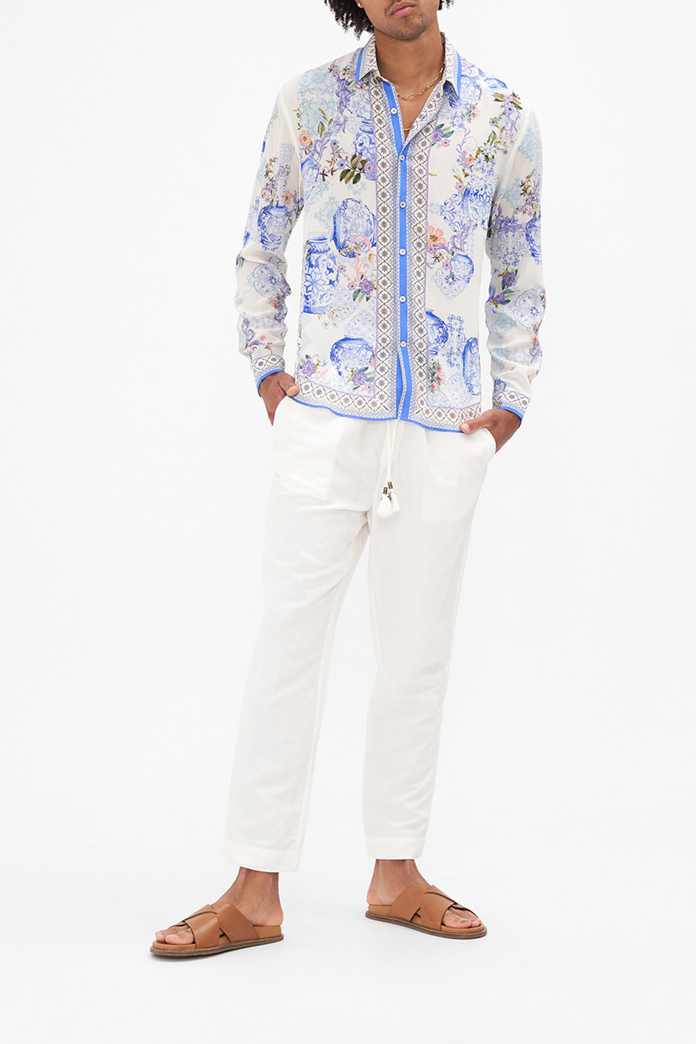 Front view of model wearing HOTEL FRANKS BY CAMILLA white and blue floral mens shirt in Paint Me Positano print