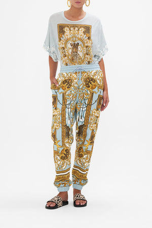Front view of model wearing CAMILLA printed trackpants in Palazzo Pride print