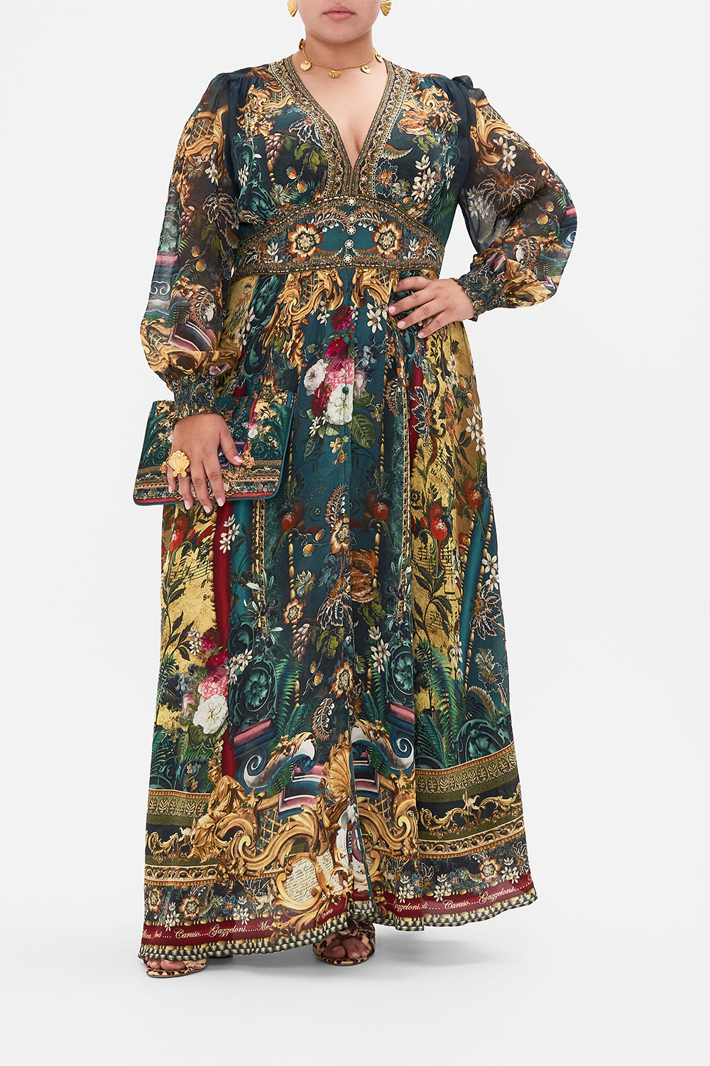 Front view of curvy model wearing CAMILLA silk plus size maxi dress in Verdi's World print