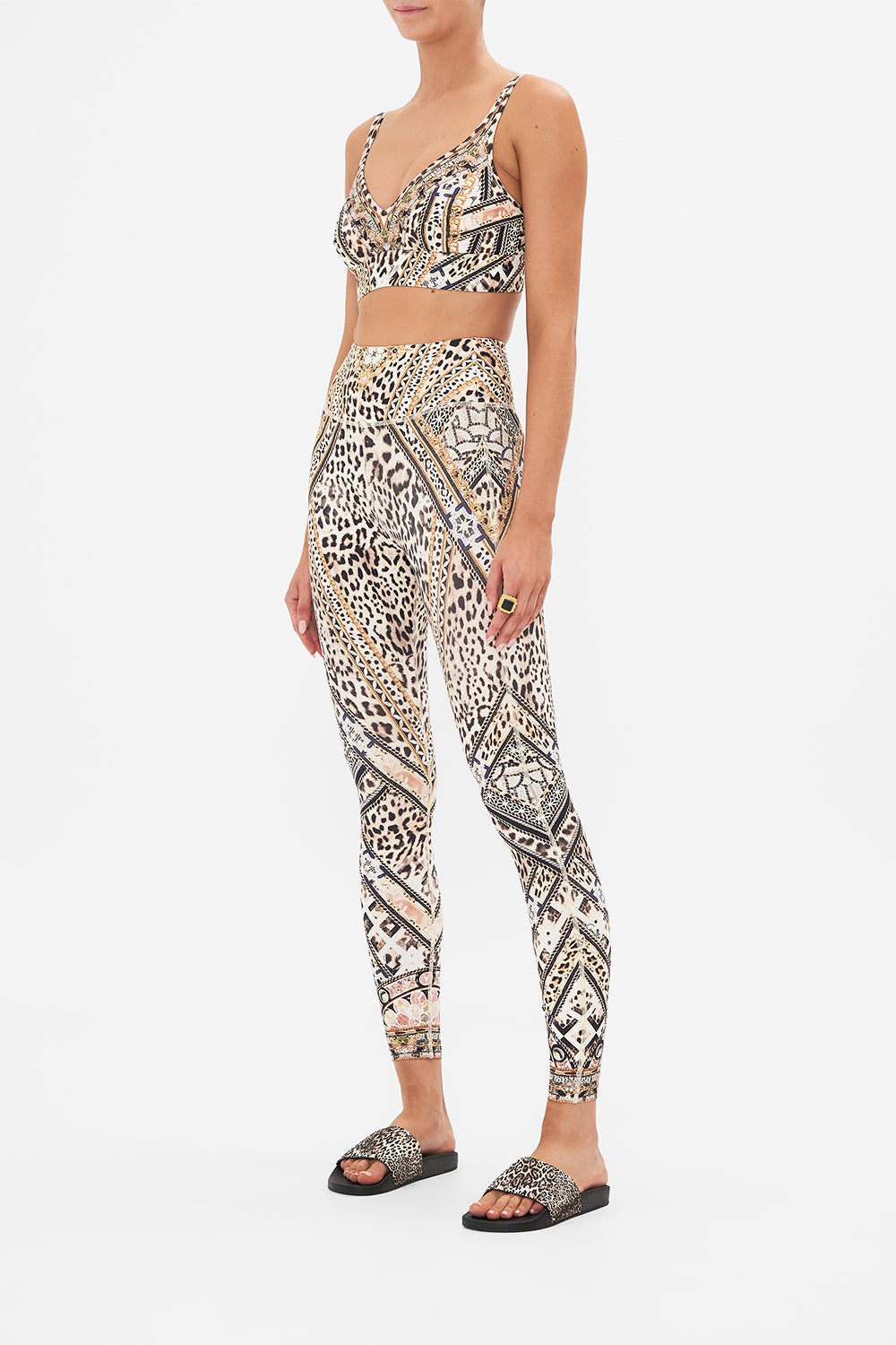 Side view of model wearing CAMILLA animal print leggings in Mosaic Muse