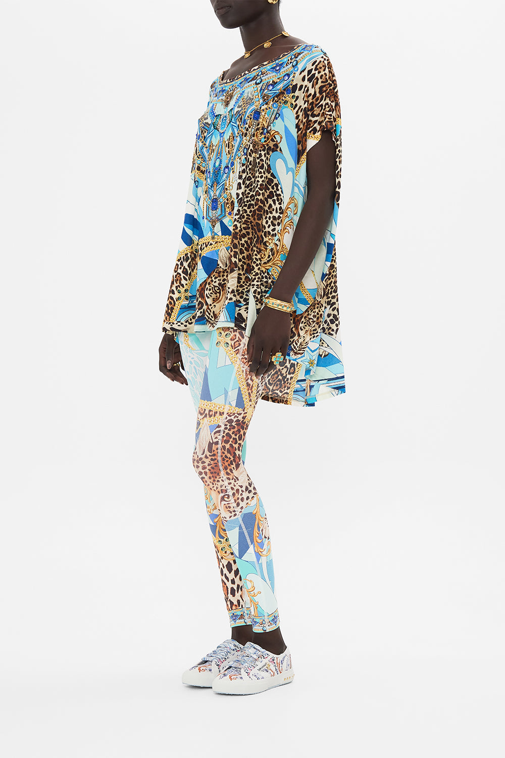 Side view of model wearing CAMILLA designer t shirt in Sky Cheetah print 