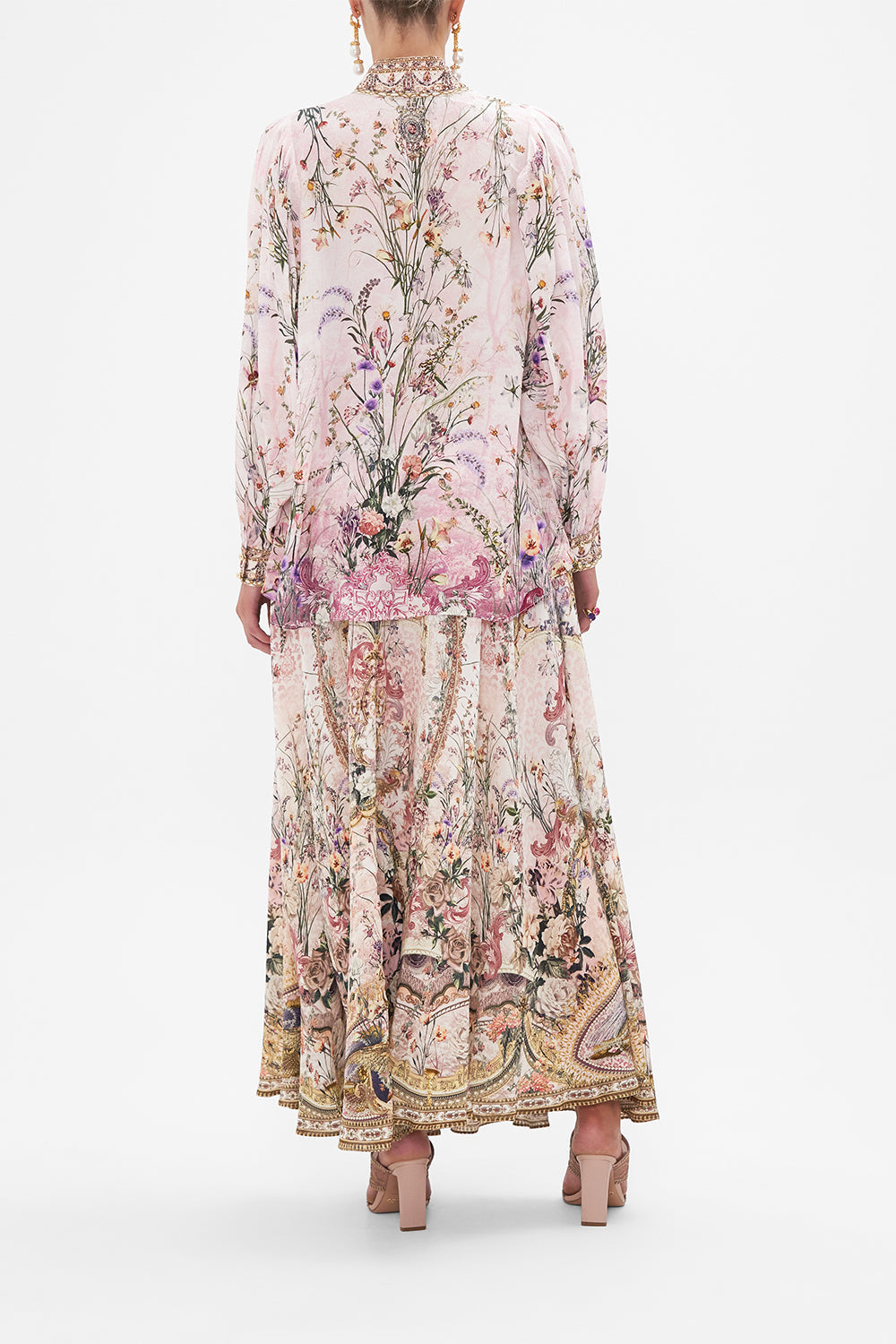 Back view of model wearing CAMILLA floral slik blouse in Kissed By The Prince print