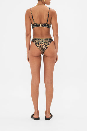 Back view of model wearing CAMILLA  luxury bikini bottom in Masked At Moonlight print