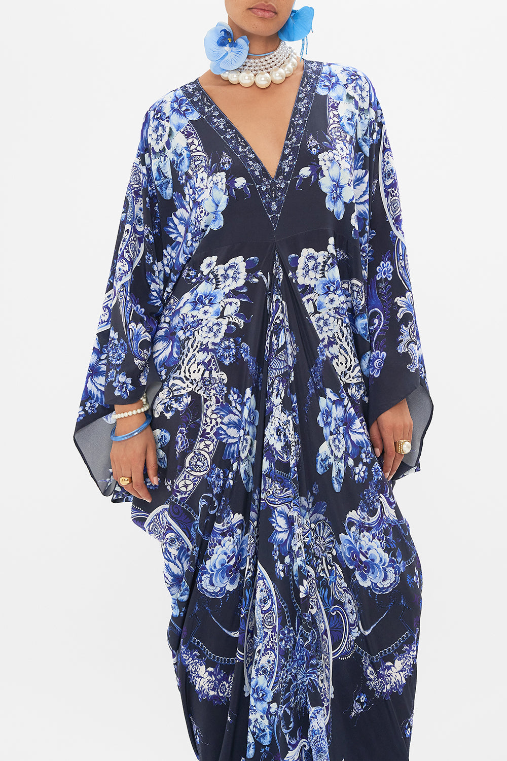 Crop view of model wearing CAMILLA silk kaftan in Delft Dynasty print