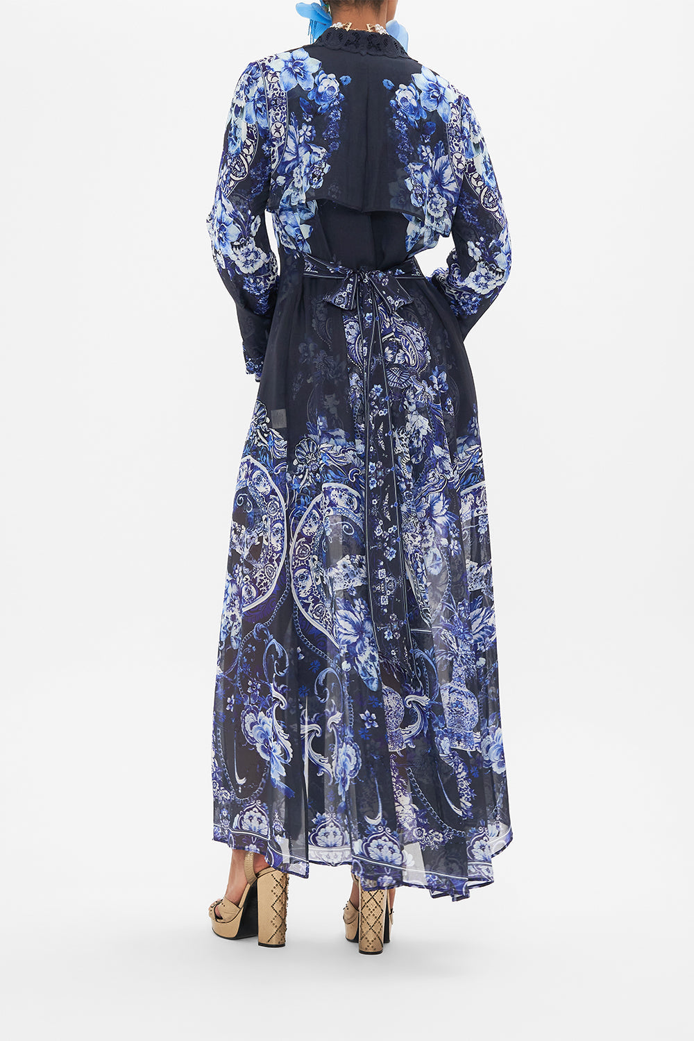 Back view of model wearing CAMILLA silk trench in Delft Dynasty print