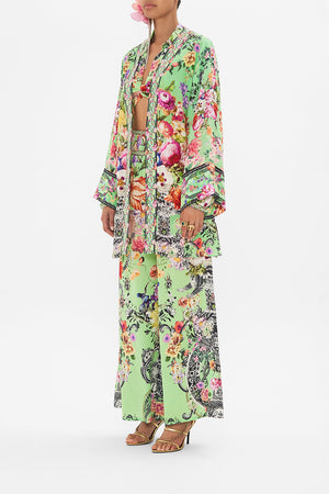 Side view of model wearing CAMILLA silk kimono in Porcelain Dream print