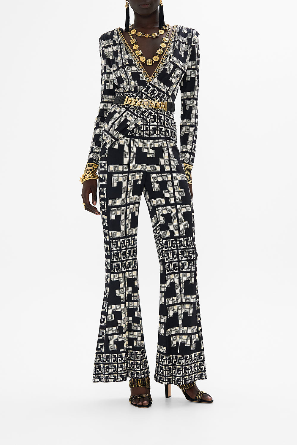 The CAMILLA LEOPARD BUTTON ELASTIC BELT SOLID BLACK in our  print.