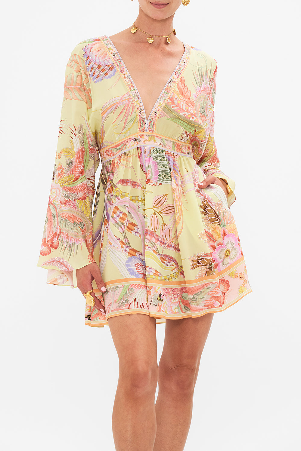 Crop view of model wearing CAMILLA silk kimono mini dress in Cosmic Tuscan print 