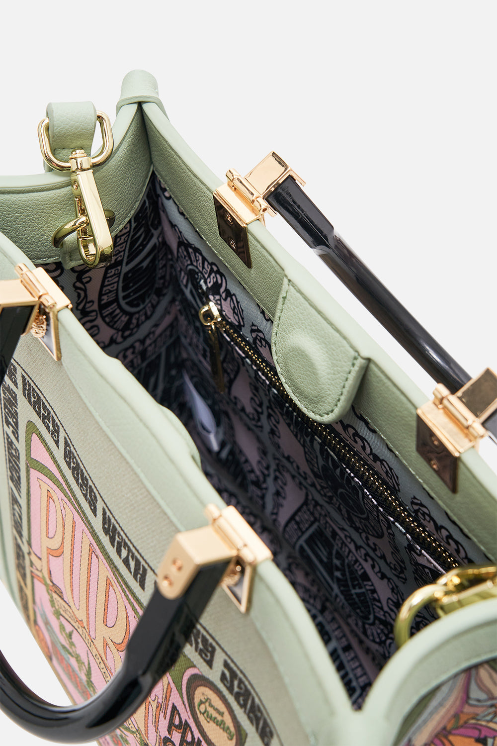 The CAMILLA NORTH SOUTH TOTE WITH SMOOTH HANDLE LETS CHASE RAINBOWS in our  print.