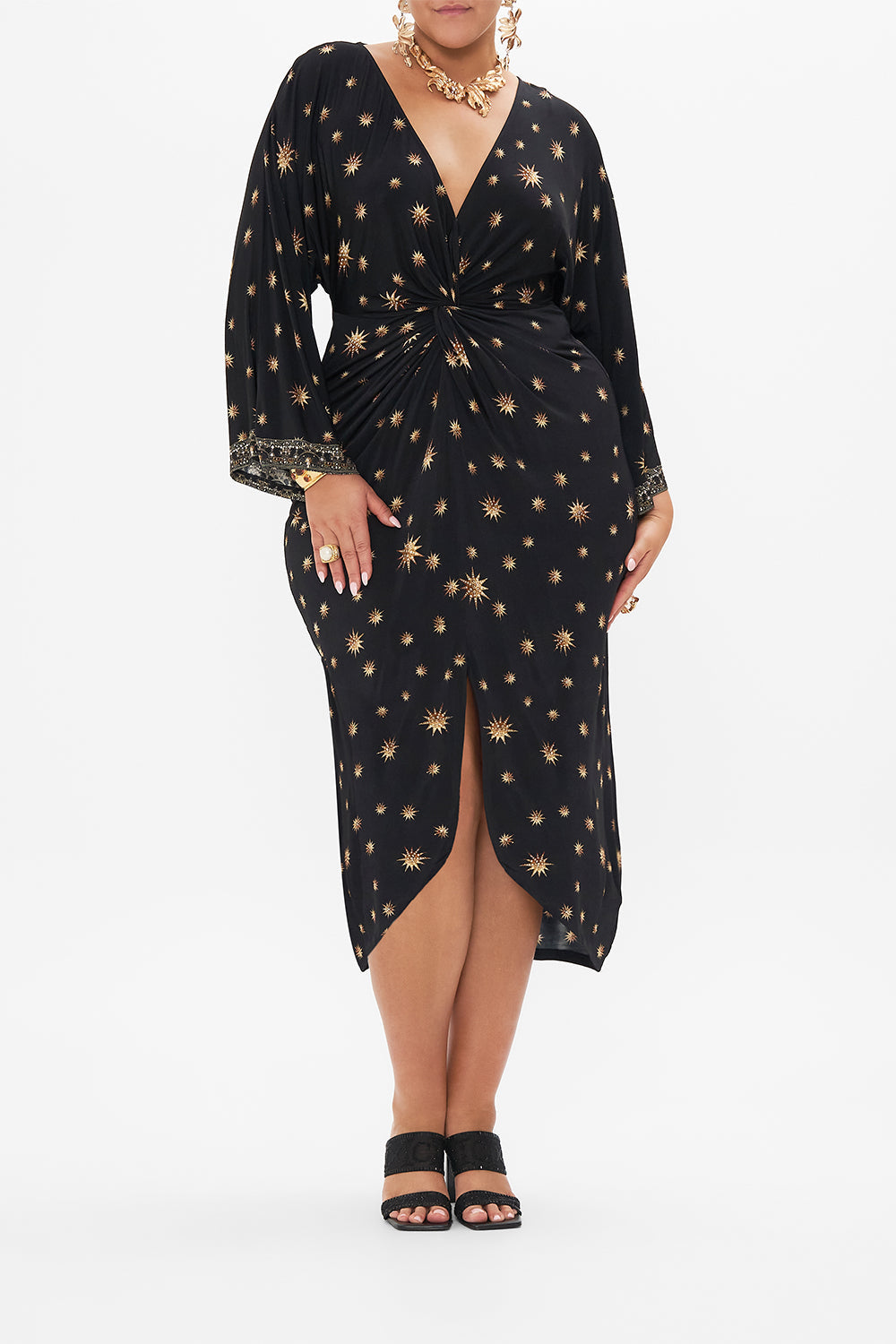 Front view of curvy model wearing CAMILLA plu size black jersey dress in Soul Of A Star Gazer print 