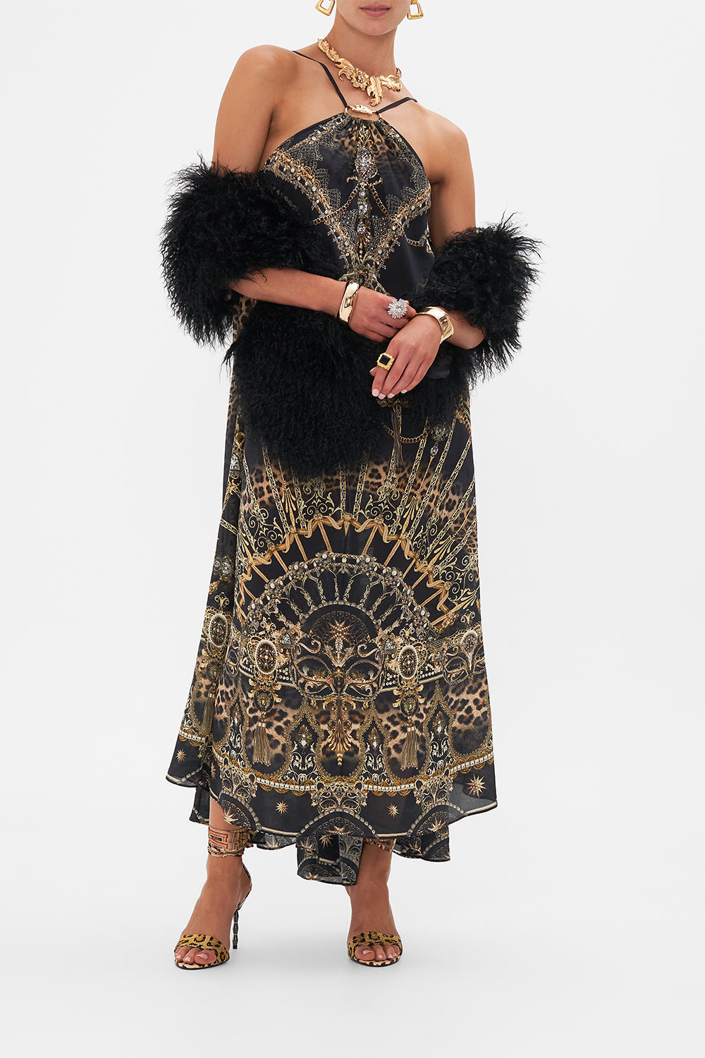 Crop view of model wearing CAMILLA designer halterneck maxi dress in masked At Moonlight print