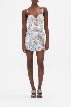 Front view of model wearing CAMILLA designer silk shorts in Season Of The Siren print