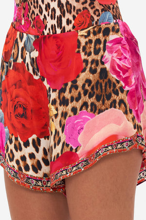 Detail view of model wearing CAMILLA silk shorts in Heart Like A Wildflower print