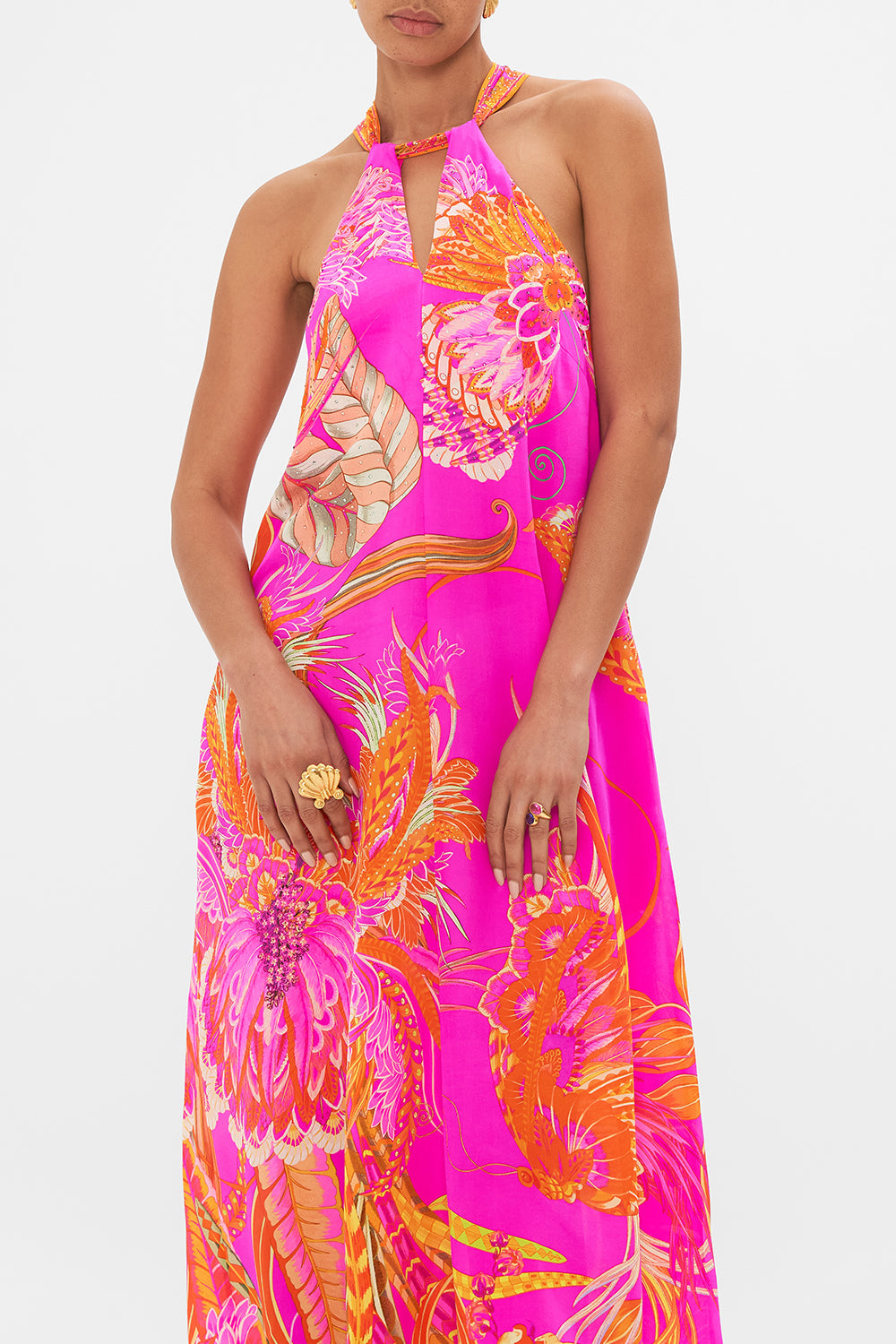 Crop view of model wearing CAMILLA silk neck tie dress in A Heart That Flutters print