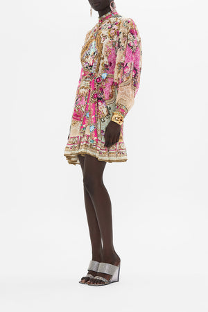 Side view of model wearing CAMILLA pink shirt dress in Call Of The Canal print