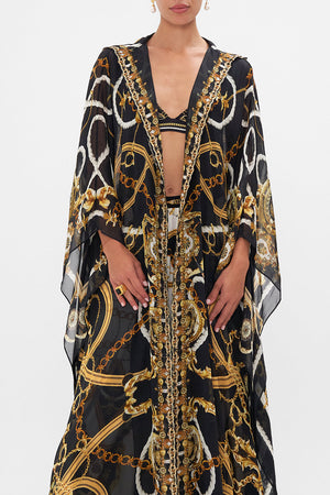 Crop view of model wearing CAMILLA silk robe in Coast To Coast print