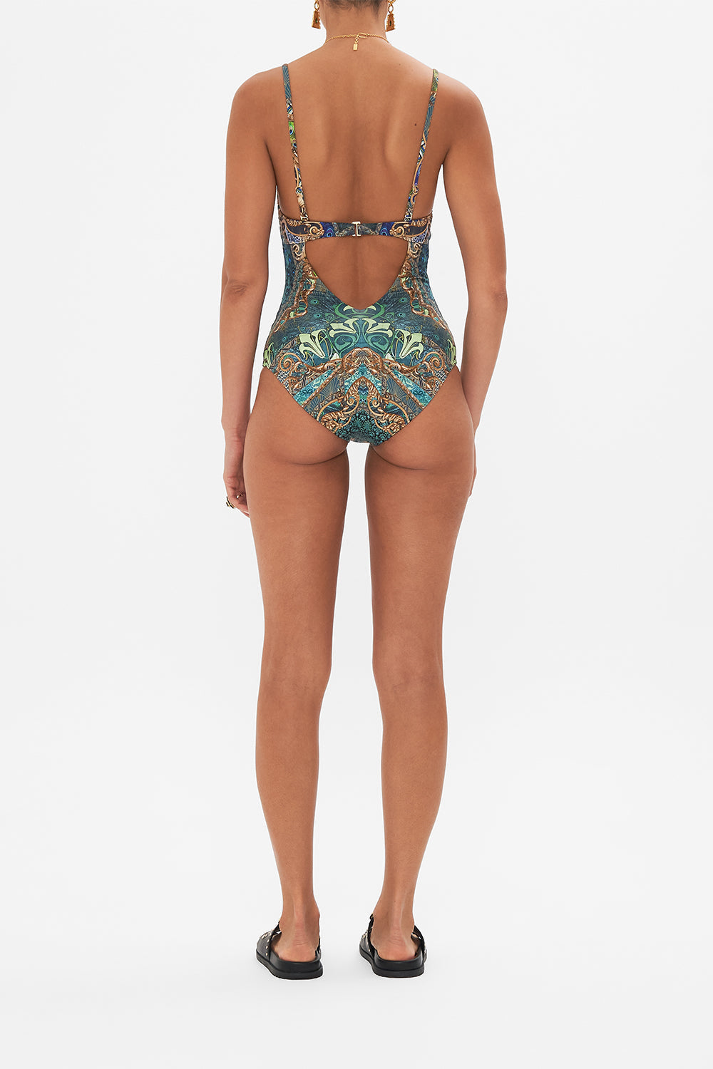 Back view of model wearing CAMILLA one piece swimsuit in Fan Dance print
