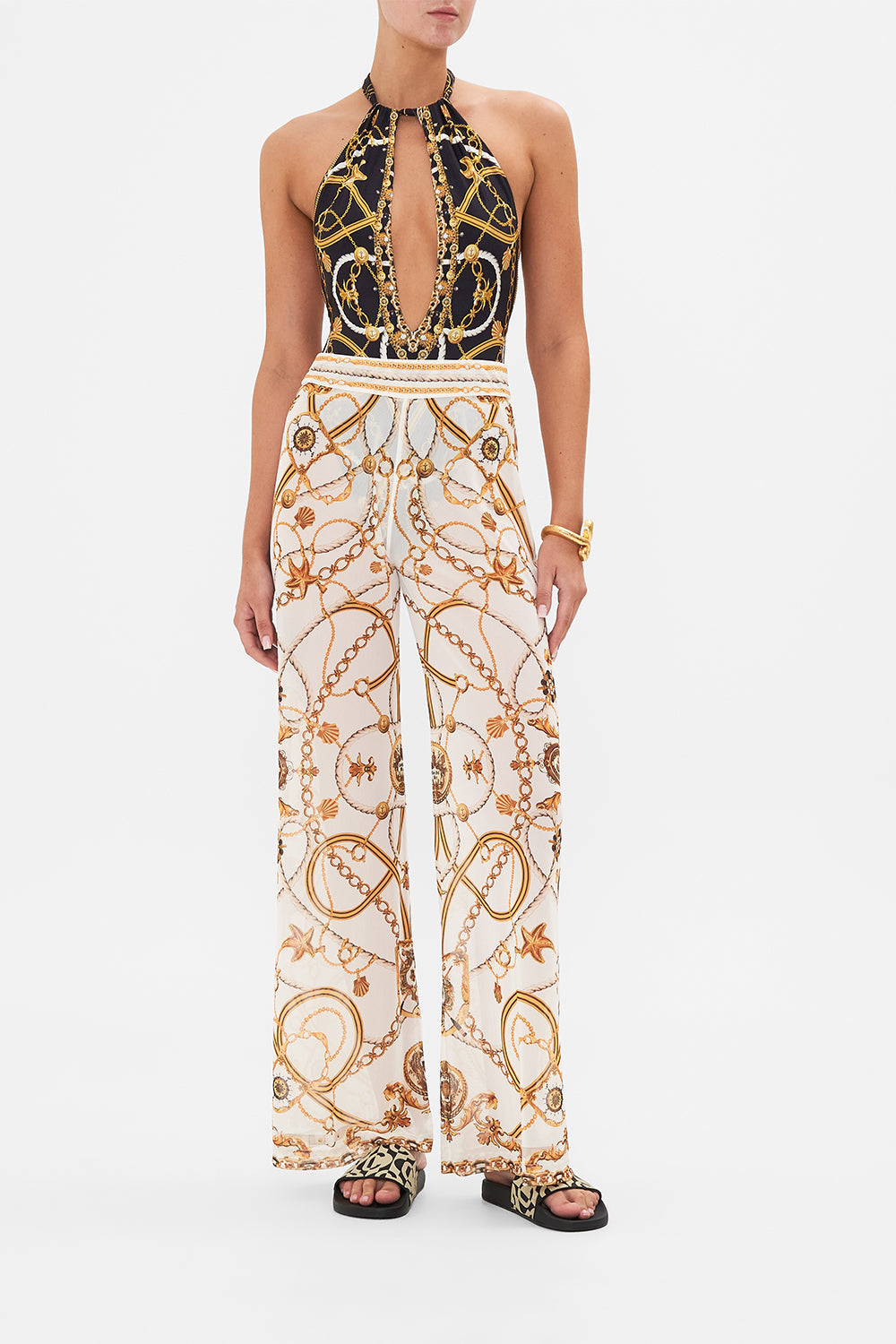 Front view of model wearing CAMILLA sheer mesh pants in Coast To Coast print 