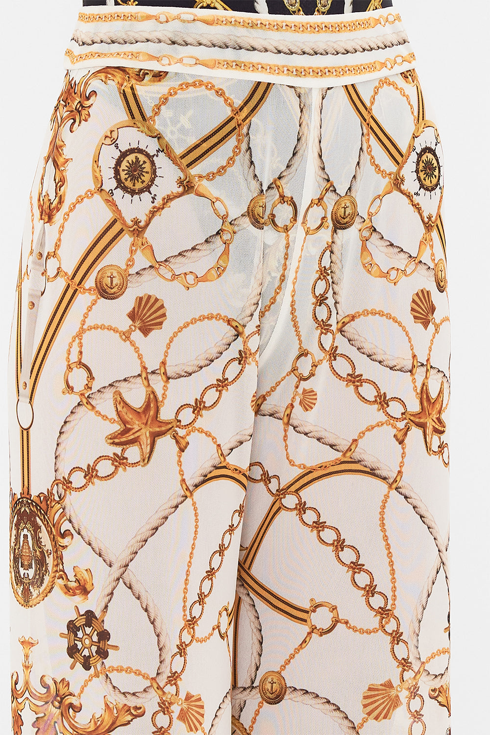 Detail view of model wearing CAMILLA sheer mesh pants in Coast To Coast print 