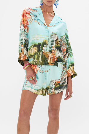 Crop view of model wearing CAMILLA silk shirt in From Sorrento With Love print