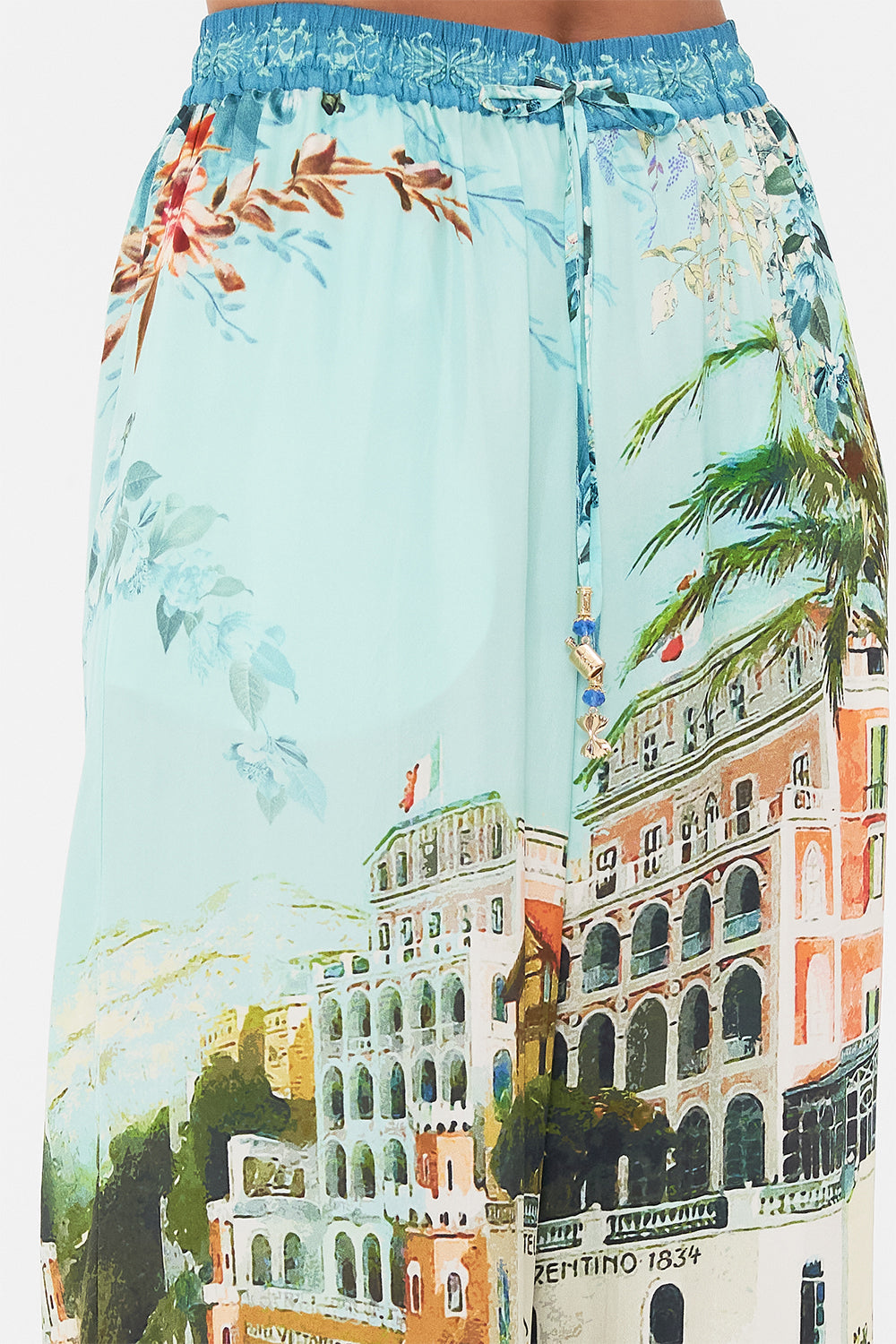 Detail view of model wearing CAMILLA silklounge pant in From Sorrento With Love print