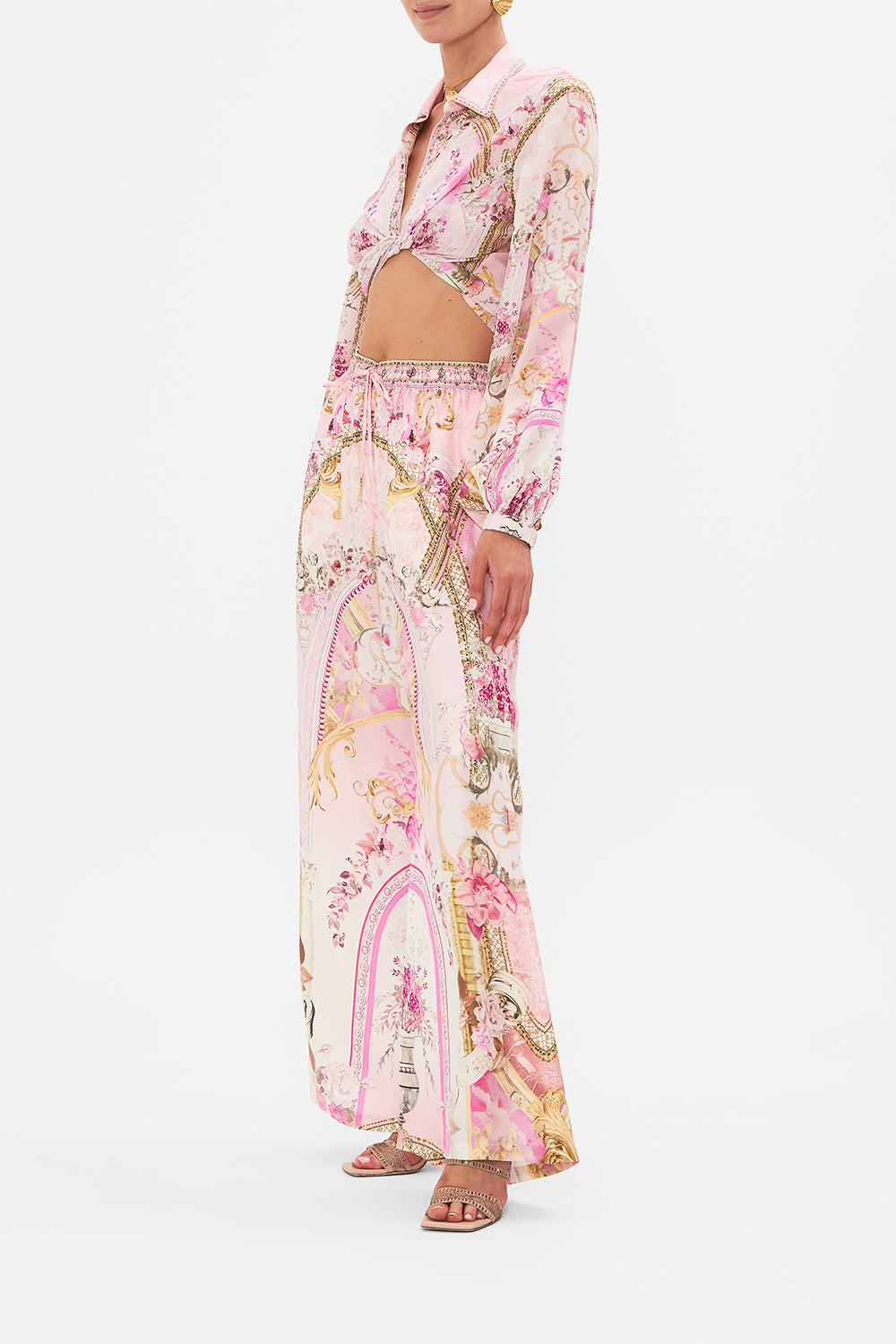 Side view of model wearing CAMILLA silk lounge pant in Feeling Fresco print 
