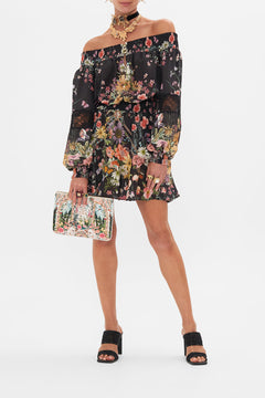 Front view of model wearing CAMILLA  off the shoulder mini dress in Letters From A Vineyard print