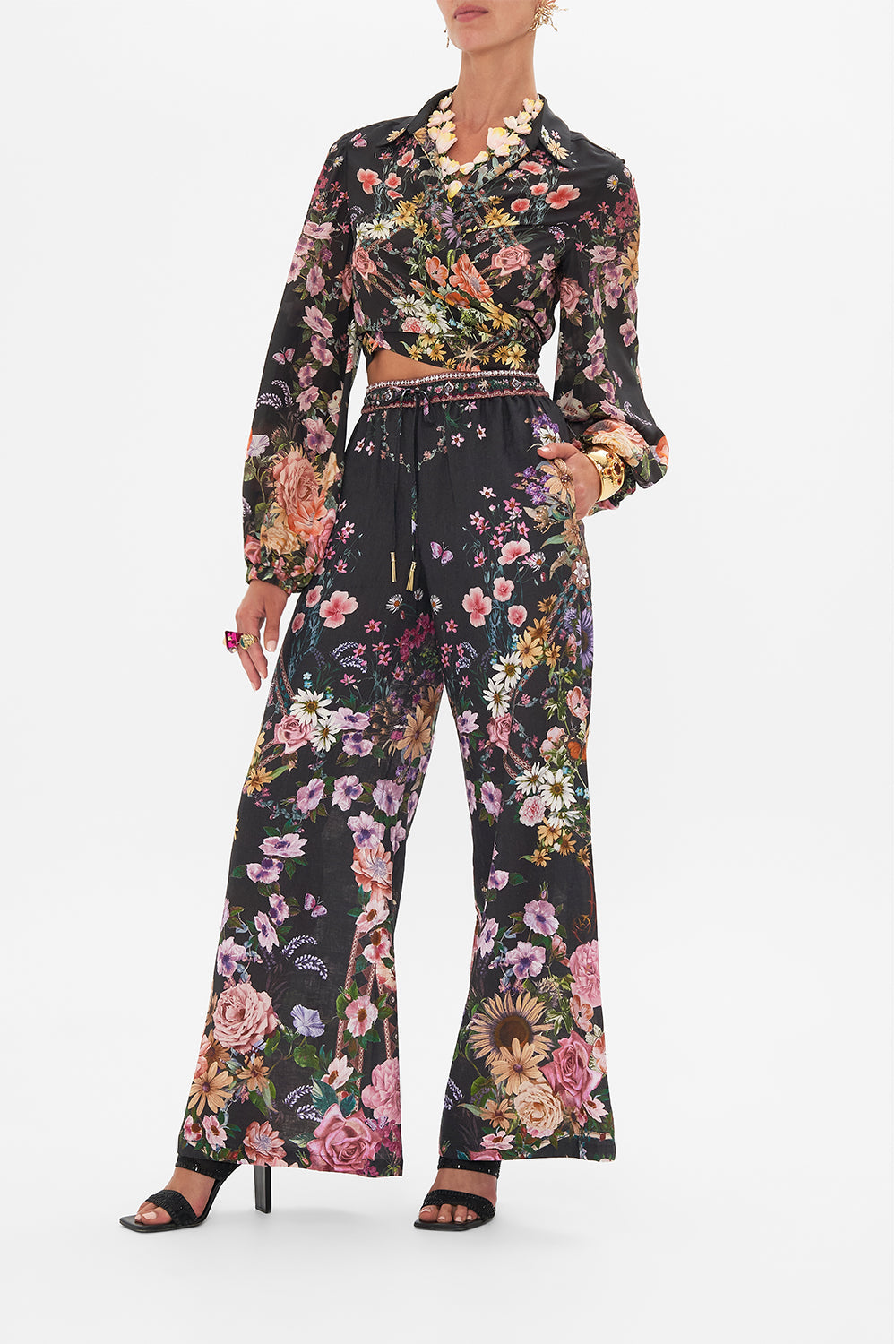 Side view of model wearing CAMILLA linen lounge pant in Letters From A Vineyard print 