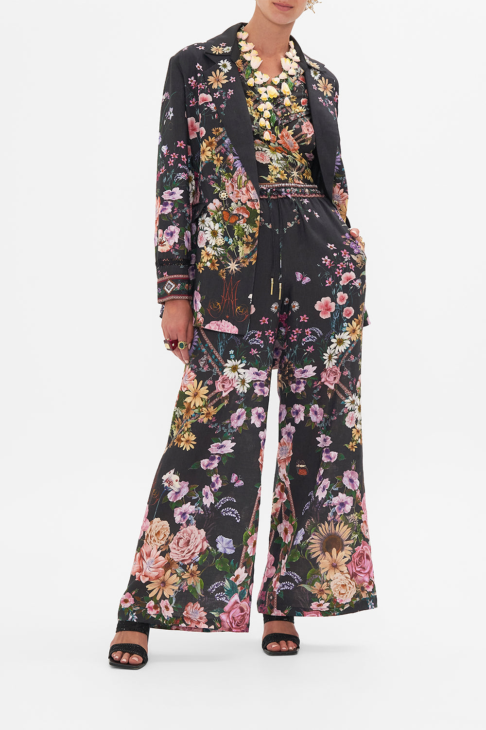 Detail view of model wearing CAMILLA linen lounge pant in Letters From A Vineyard print 