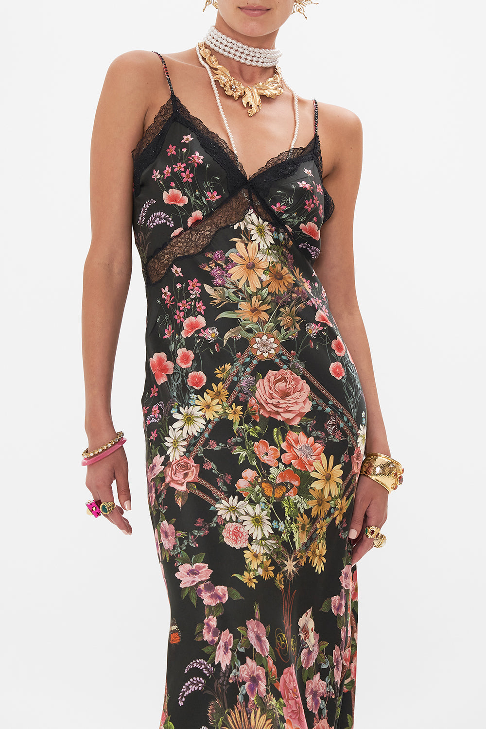 Crop view of model wearing CAMILLA bias silk slip dress in Letters From A Vineyward print