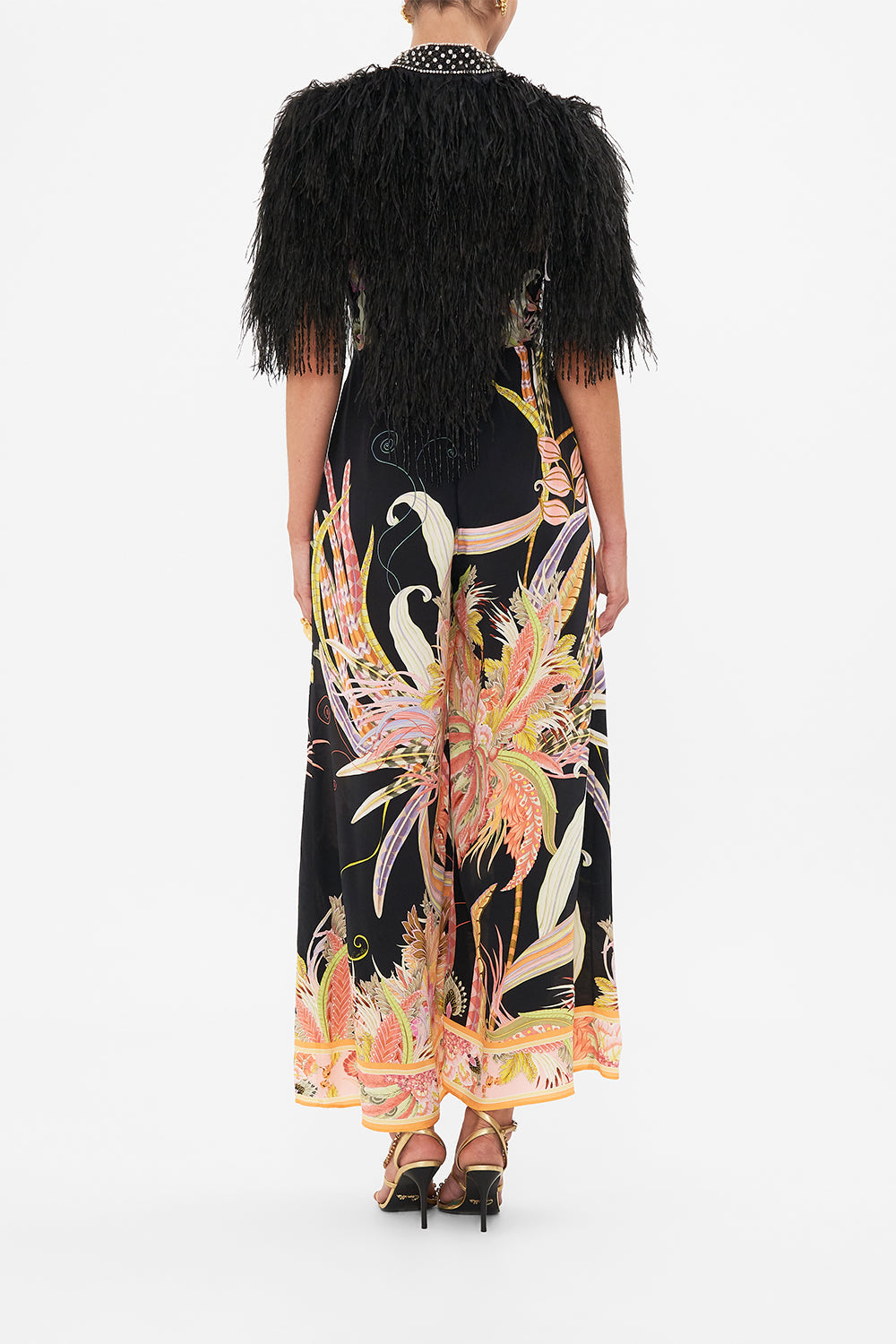 Back view of model wearing CAMILLA beaded feather gilet in Lady of The Moon print