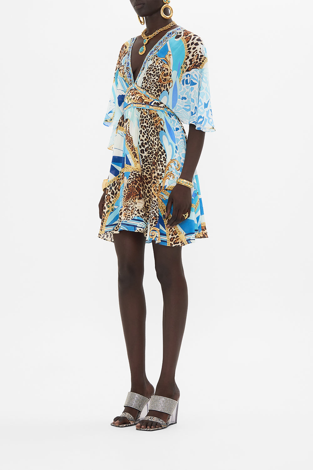 Side view of model wearing CAMILLA silk mini dress in Sky Cheetah print
