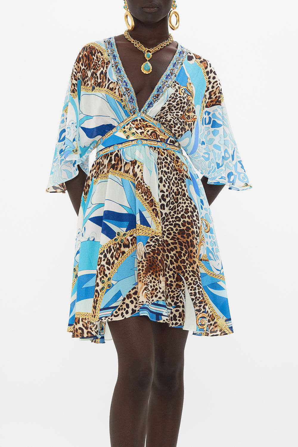 Crop view of model wearing CAMILLA silk mini dress in Sky Cheetah print