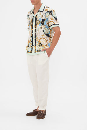 Side view of model wearing Hotel Franks By CAMILLA mens shirt Sea Charm print