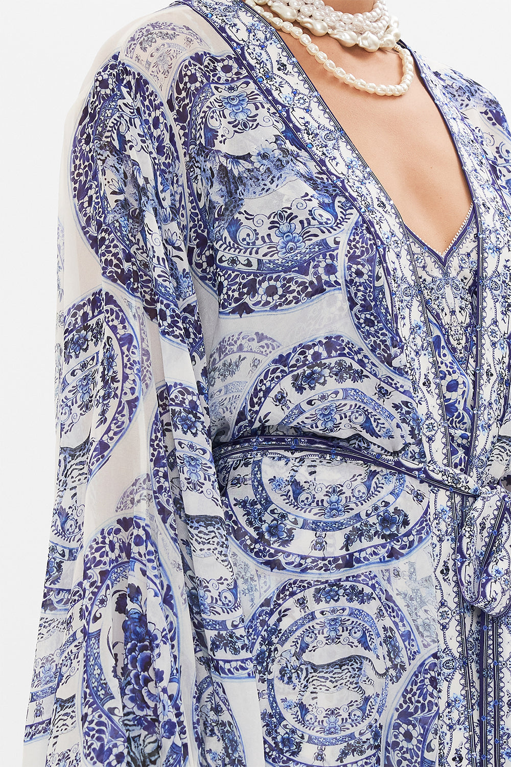 Detail view of model wearing CAMILLA silk layer in Glaze and Graze print 
