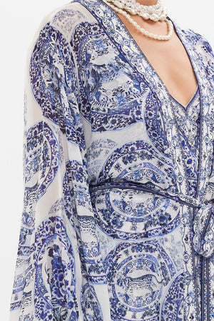 Detail view of model wearing CAMILLA silk layer in Glaze and Graze print 