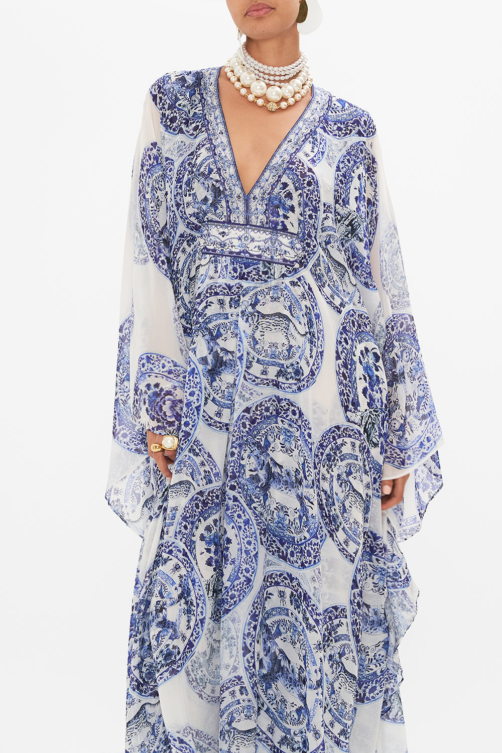 Crop view of model wearing CAMILLA silk kaftan in Glaze and Graze print 