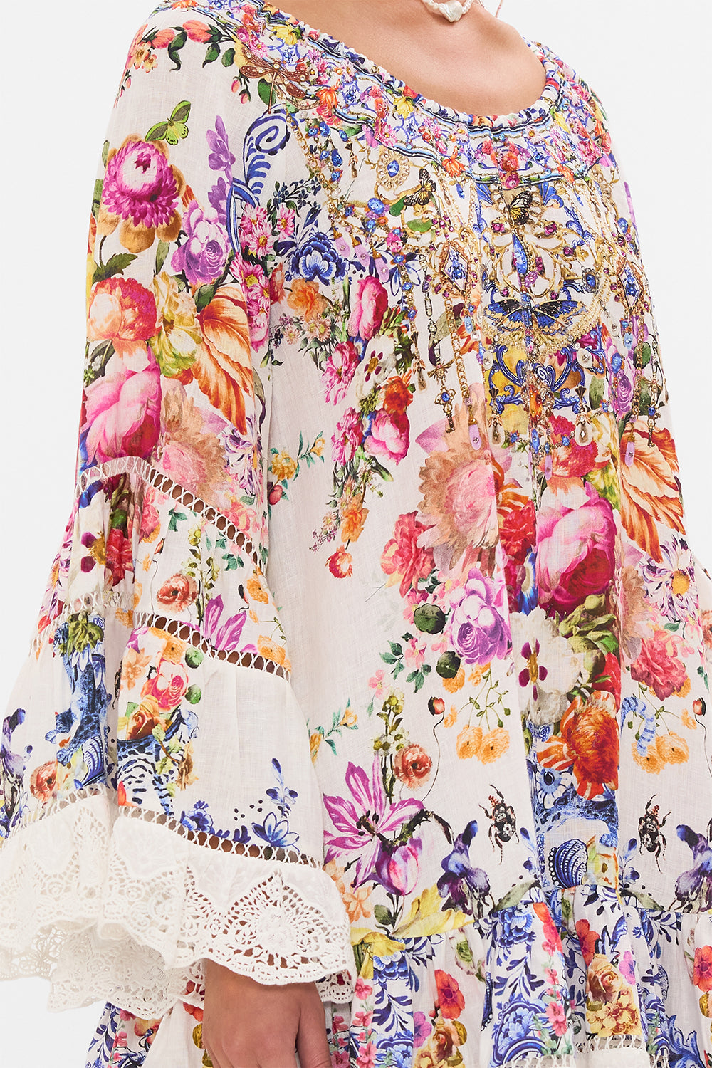 Detail view of model wearing CAMILLA frill dress in Dutch Is Life print