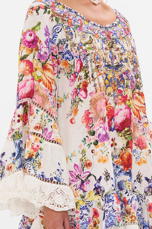 Detail view of model wearing CAMILLA frill dress in Dutch Is Life print