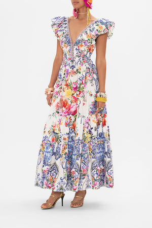 Side view of model wearing CAMILLA silk dress in Dutch is Life print