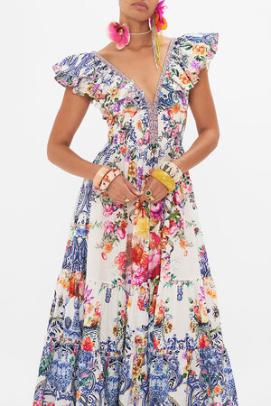 Crop view of model wearing CAMILLA silk dress in Dutch is Life print