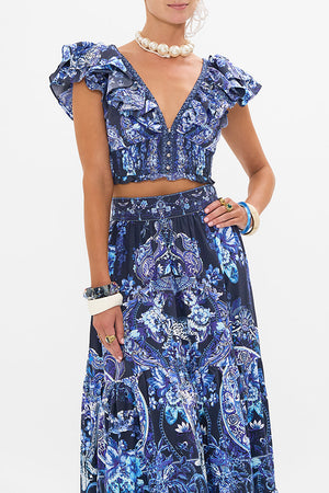 Crop view of model wearing CAMILLA ruffle top in Delft Dynasty print 