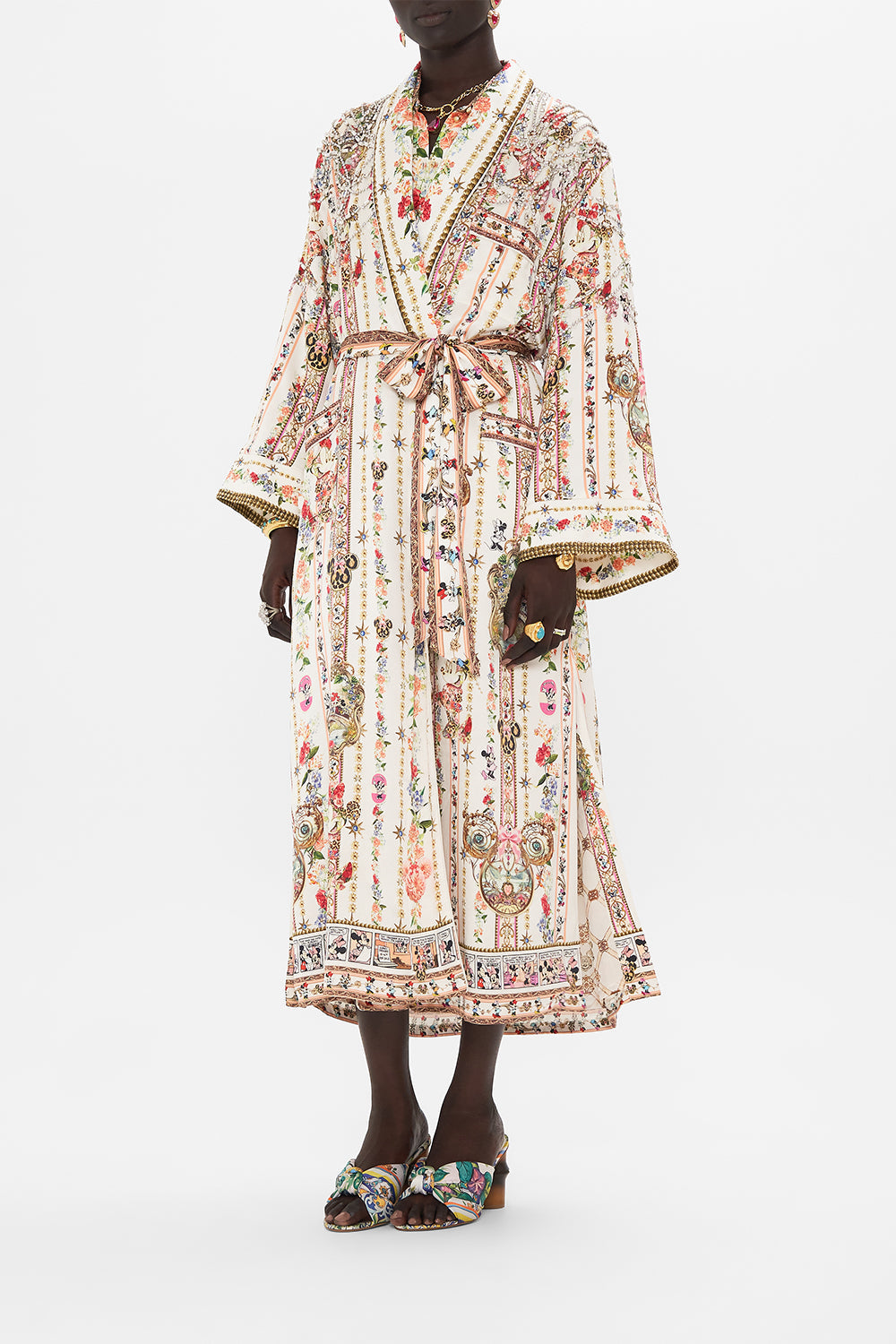 Side view of model wearing Disney x CSAMILLA silk robe in Minnie Magic Forever print 