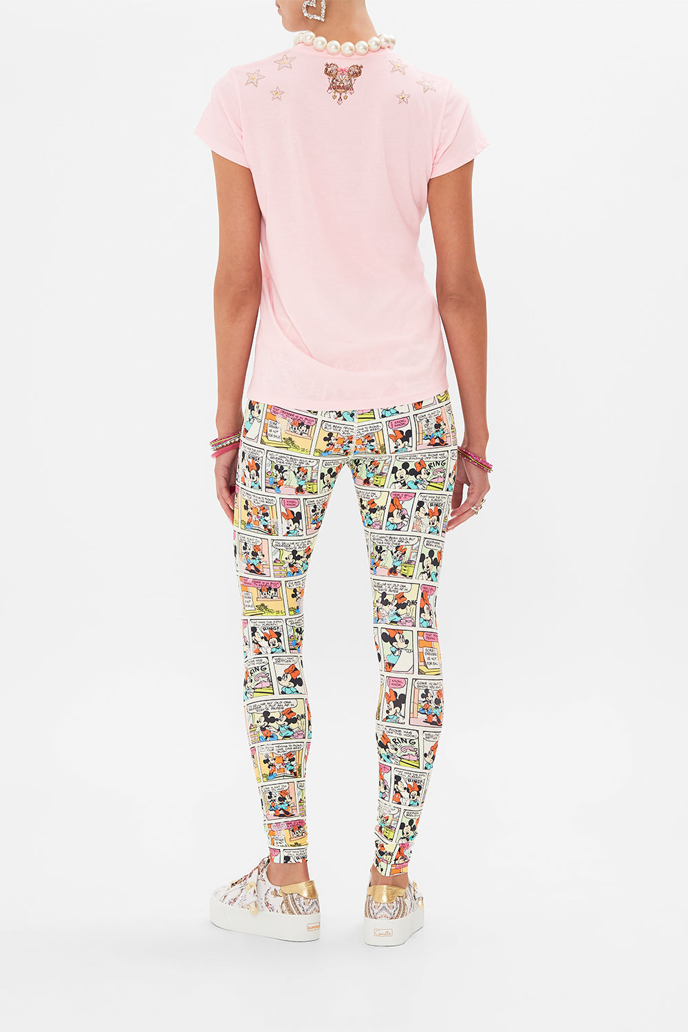 Back view of model wearing Disney x CAMILLA pink t shirt in Minnie Mouse Magic print