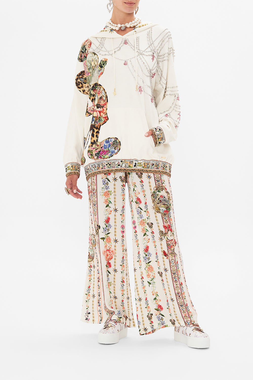 Front view of model wearing Disney x CAMILLA hoodie in Minnie Magic Forever print