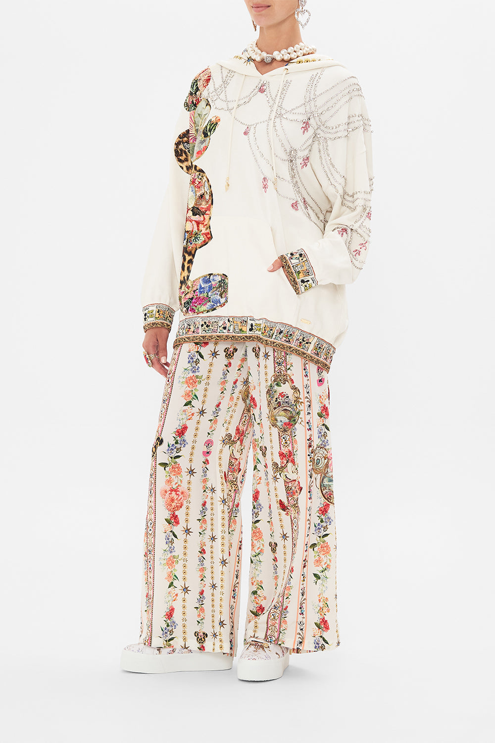 Side view of model wearing Disney x CAMILLA hoodie in Minnie Magic Forever print