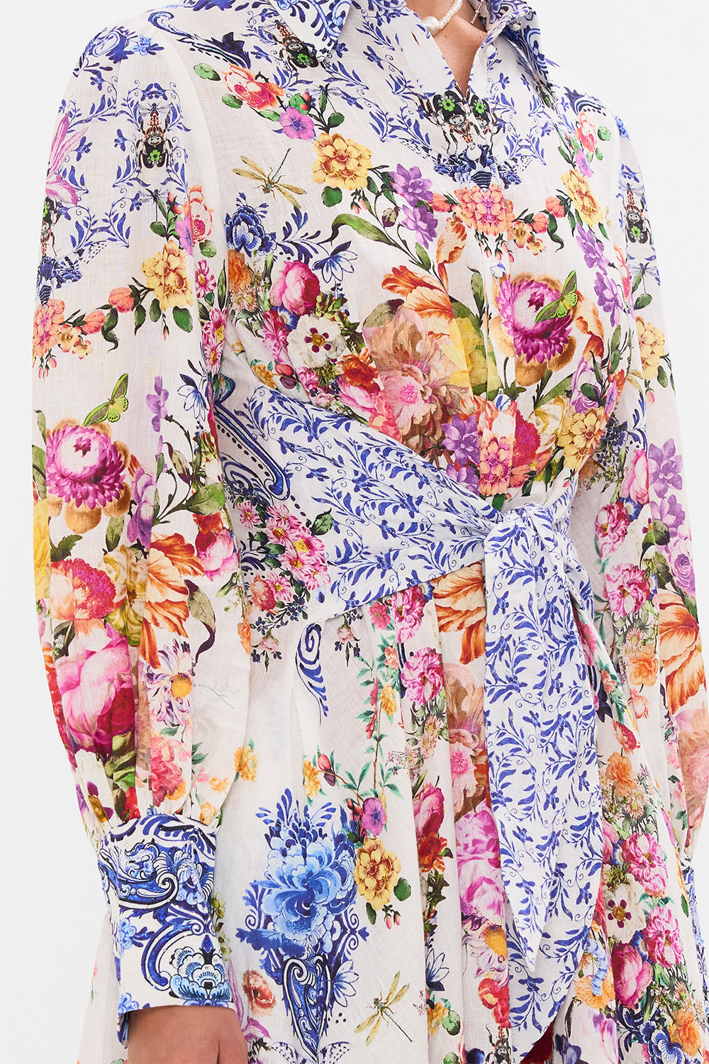 Detail view of model wearing CAMILLA silk shirt dress in Dutch Is Life print